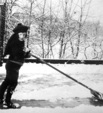 Snow shoveling is part of the fun. Fess Blanchard puts his daughter Molly to work!