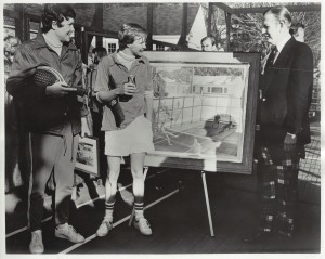 Steve Baird (left) and Chip Baird being presented with reproductions of the Robert Sticker oil painting by Charles Millard, President of Coca-Cola Bottling NY