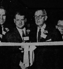 : President Ollie Kingsbury wields the scissors as the new wing is formally opened. Watching are Governors Wilson, Sullivan, Ware, Nagle, Hammer, Tredwell and Close