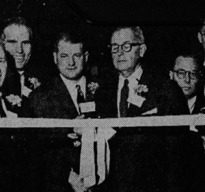 : President Ollie Kingsbury wields the scissors as the new wing is formally opened. Watching are Governors Wilson, Sullivan, Ware, Nagle, Hammer, Tredwell and Close