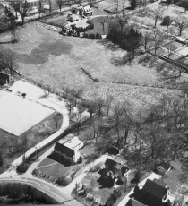 Aerial view of FMTC in 1937. At the left stands the windmill in Crane Meadow, just below Church Lane. The first paddle court can be seen at the curve of the driveway.