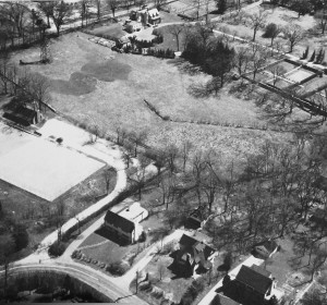 Aerial view of FMTC in 1937. At the left stands the windmill in Crane Meadow, just below Church Lane. The first paddle court can be seen at the curve of the driveway.