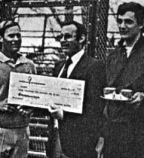 Passport Scotch's Jeff Gollin presents winning check to Steve Baird (left) and Rich Maier. Runners-up were Herb Fitz Gibbon and Hank Irvine