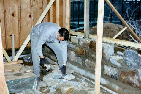 Mason at work on new wing