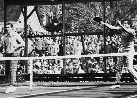 1975 Nationals at Fox Meadow Tennis Club. John Mangan at net and Bob Kingsbury returning an overhead