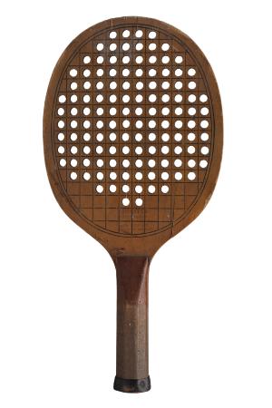 Early paddle with holes. The Old Army Athletes had worked with the Paddle Tennis Company to modify the standard paddle tennis paddle design to create a more rounded paddle with holes.