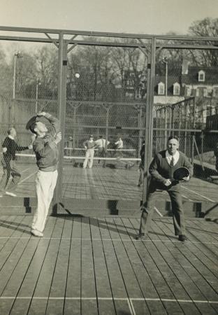 Earle Gatchell (serving) and Fess Blanchard play at Fox Meadow Tennis Club.