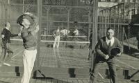 Earle Gatchell (serving) and Fess Blanchard play at Fox Meadow Tennis Club.