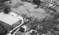 Aerial view of Fox Meadow Tennis Club in 1937. At the left stands the wind-mill in Crane Meadow, just below Church Lane. The first paddle court can be seen at the curve of the driveway.