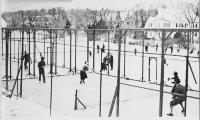 Winter activity at Fox Meadow Tennis Club in the 1930s. Platform tennis in the foreground and ice skating just beyond.