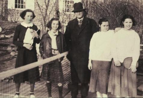 Frank Beal, inventor in 1911 of the playground form of paddle tennis, at the Cogswell court in March 1936. The winners of the New York City Junior Girls’ Championship played Do Cogswell and Ruth Blanchard (at left), winners of the Fox Meadow Tennis Club Junior Championship.