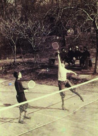 Juniors played platform tennis from the start: Horton Heath (left) and a friend practice at the original Cogswell court.
