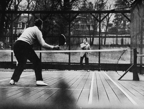 Dick Hebard driving at Rawle Deland at net