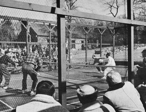 1959 Men's Nationals Semi-Finals - Ward Chamberlain hits a low volley. Carlisle (left) and Hebard in foreground