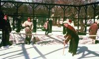 Charlie Johnson, foreground, inspires the snow shovelers with his own energy in the early years before under-court heaters