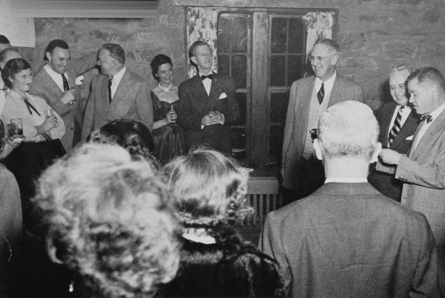 Jim Carlisle reads his epic poem "Hiawatha," a tribute to co-founders Blanchard and Cogswell on the twenty-fifth anniversary of the founding of paddle tennis. Among the appreciative audience: Maizie Moore, Dick Hebard, Elliott Wilson, Violet Wellington and Earle Gatchell